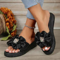 Pantuflas con detalle de lazo de strass